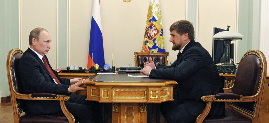 Russian President Vladimir Putin, left, listens to Chechnya's regional leader Ramzan Kadyrov during a meeting at the Novo-Ogaryovo residence outside Moscow, Russia, Monday, April 7, 2014.