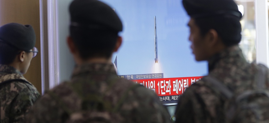 South Korean army soldiers watch a TV news program with file footage about North Korea's rocket launch at Seoul Railway Station in Seoul, South Korea, on Feb. 7, 2016.