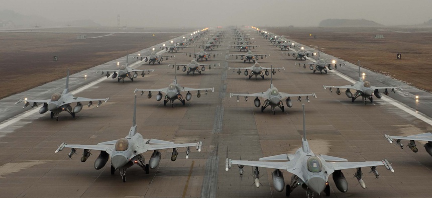 F-16 Fighting Falcons demonstrate an 'Elephant Walk' as they taxi down the flightline at Kunsan Air Base, South Korea, Dec. 14, 2012.