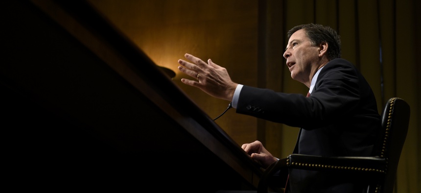 FBI Director James Comey testifies on Capitol Hill in Washington, Wednesday, Dec. 9, 2015, before the Senate Judiciary Committee.