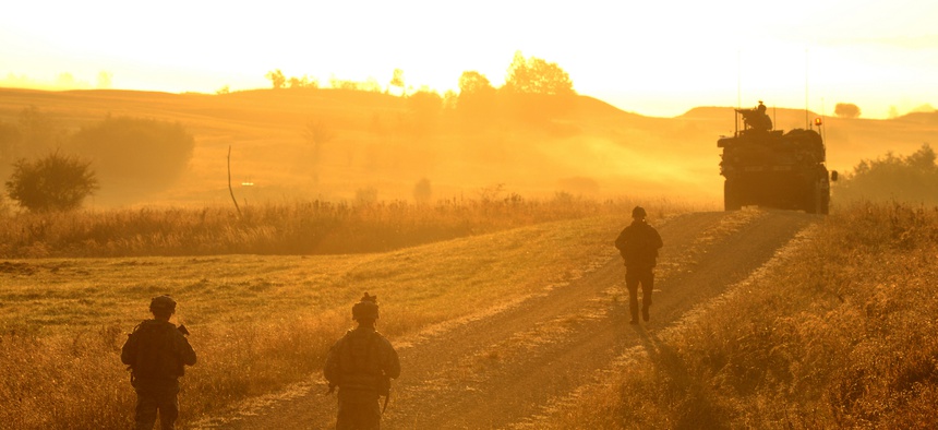 U.S. Army soldiers from the 2nd Cavalry Regiment, patrol a road at the Grafenwoehr Training Area during Exercise Saber Junction 12 in 2012.