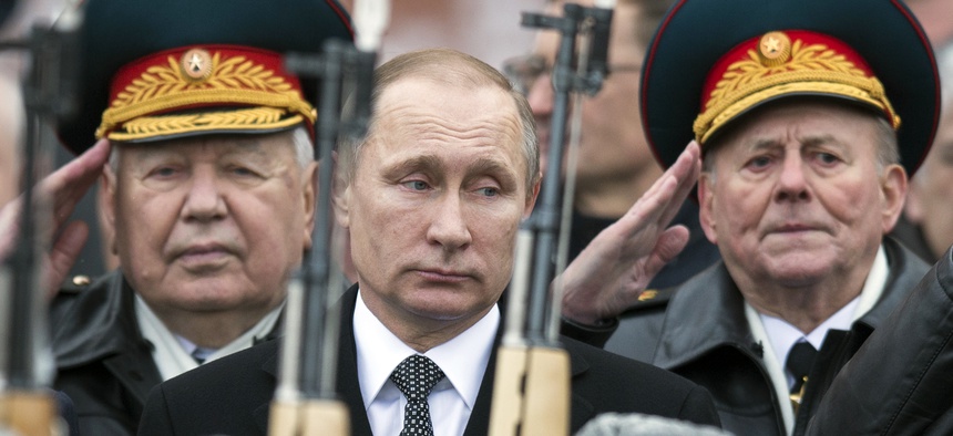 On Defenders of the Fatherland Day, Russian President Vladimir Putin attends a wreath-laying ceremony at the Tomb of the Unknown Soldier in Moscow, Feb. 23, 2016.
