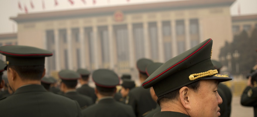 Delegates from the Chinese People's Liberation Army (PLA) arrive at the Great Hall of the People in Beijing, Friday, March 4, 2016. China said Friday it will boost military spending by about 7 to 8 percent this year, the smallest increase in six years.