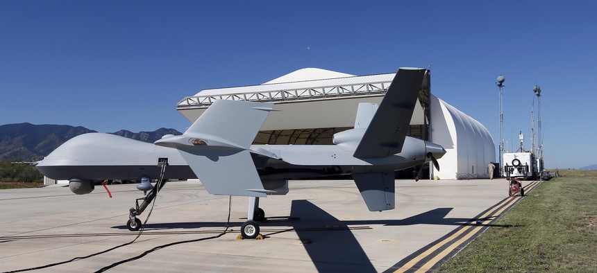 In this Sept. 24, 2014 file photo, a U.S. Customs and Border Patrol drone aircraft is prepped prior to it's flight at Ft. Huachuca in Sierra Vista, Ariz.