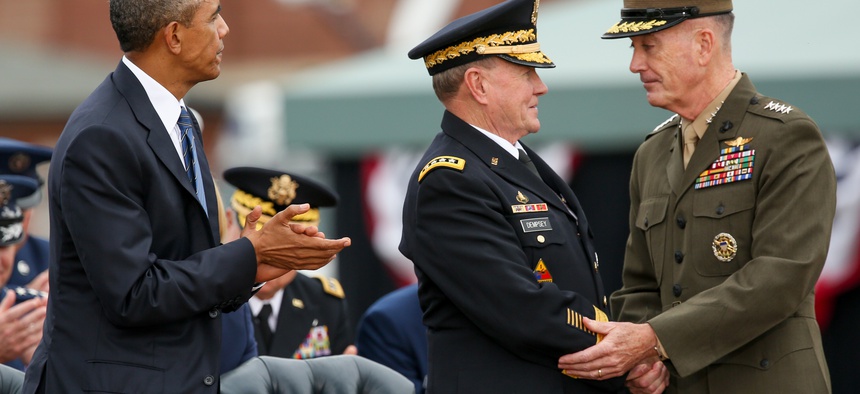 President Barack Obama watches as newly sworn-in Joint Chiefs Chairman Gen. Joseph Dunford Jr., right, shakes hands with retiring Joint Chiefs Chairman Gen. Martin Dempsey during his Armed Forces Full Honors Retirement Ceremony for Dempsey, Friday, Sept.