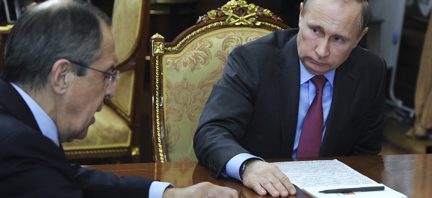 Russian President Vladimir Putin listens to Russian Foreign Minister Sergey Lavrov in a Kremlin meeting on March 14, 2016.
