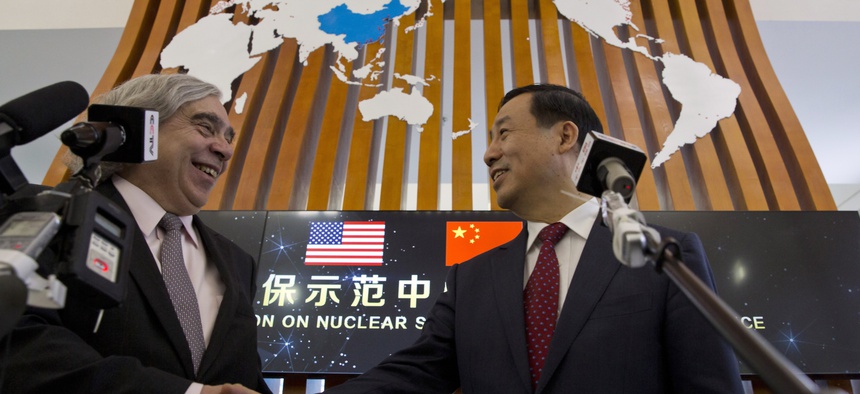 U.S. Secretary of Energy Ernest Moniz, left, and Chairman Xu Dazhe of the Chinese Atomic Energy Authority at the Nuclear Security Center of Excellence in Beijing on March 18, 2016.