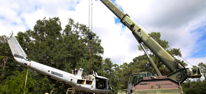 U.S. Marines use a Terex-Demag MAC-50 crane to lifts a UH-1N Huey helicopter during training at Marine Corps Base Camp Lejeune, N.C., in 2014.