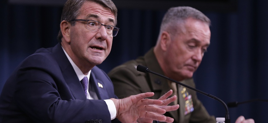 Defense Secretary Ash Carter, accompanied by Joint Chiefs Chairman Gen. Joseph Dunford, speaks during a news conference at the Pentagon, Friday, March 25, 2016.