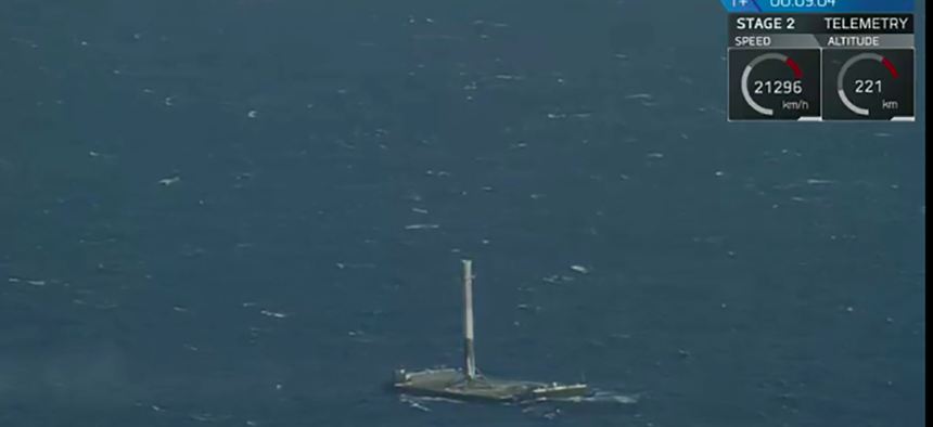 The first stage of the Falcon 9 rocket sits on its landing ship.