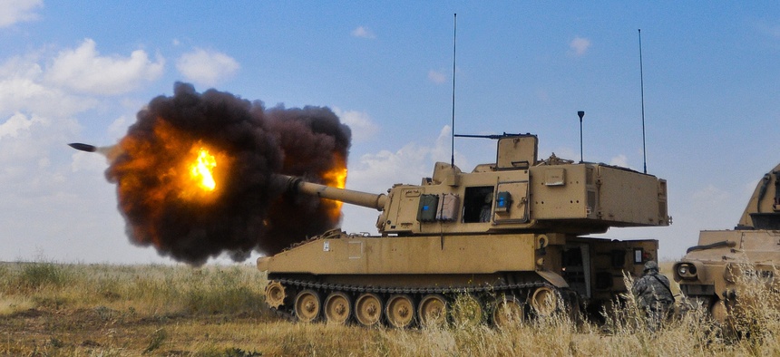An M109A6 Paladin fires a gas propelled 155mm Howitzer round at Destiny Range in Mosul, Iraq, April 23, 2010.