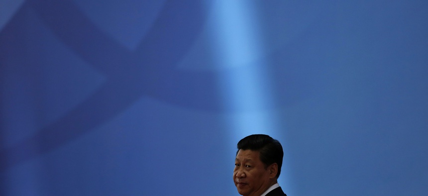 Chinese President Xi Jinping waits for leaders to arrive before a ceremony in Shanghai Wednesday, May 21, 2014.