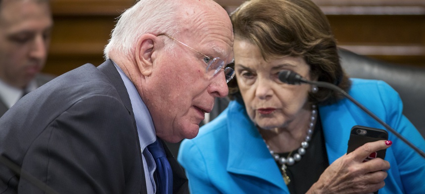 Sen. Patrick Leahy, D-Vt., the ranking member of the Senate Judiciary Committee, left, speaks with Sen. Dianne Feinstein, D-Calif., on Capitol Hill in Washington, March 10, 2016.