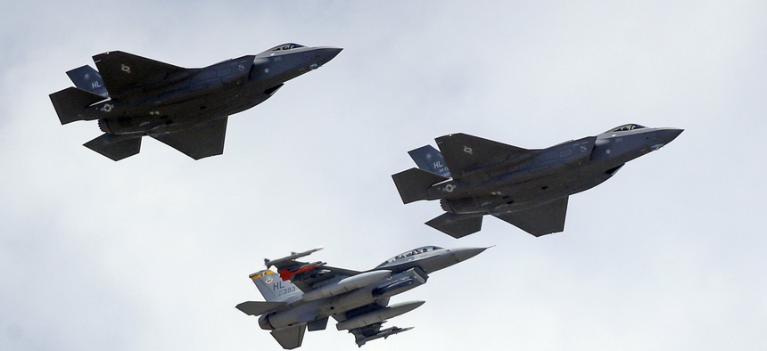 An F-16, below, escorts two F-35 jets, above, after arriving at it new operational base Wednesday, Sept. 2, 2015, at Hill Air Force Base, in northern Utah.