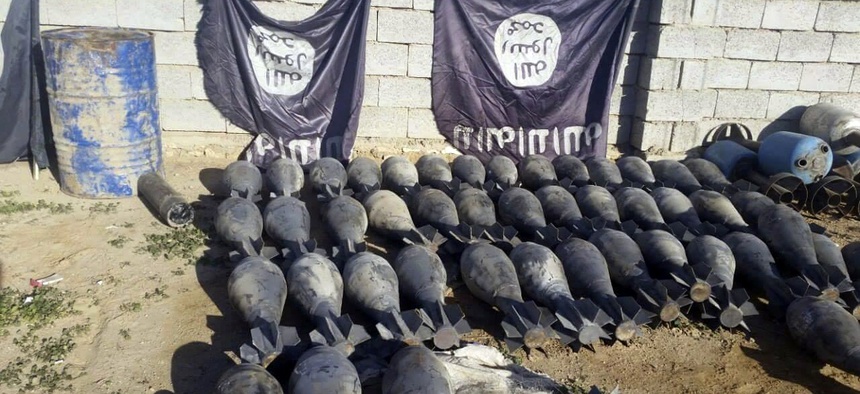 Weapons and explosives confiscated by Iraqi security forces from Islamic State militants in Ramadi in December 2015, on display at an Iraqi army base.
