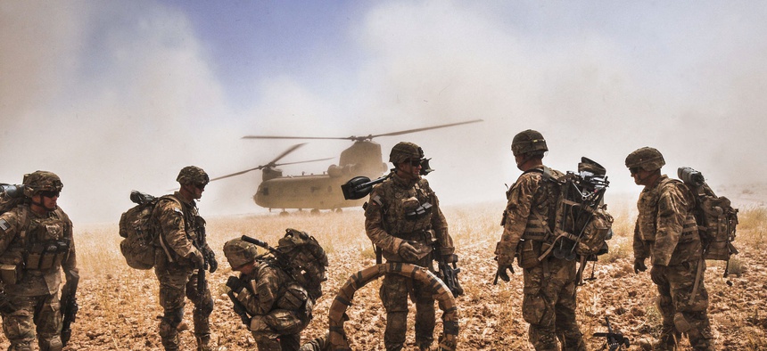 Soldiers of the 82nd Airborne Division prepare to board a CH-47F Chinook in the Nawa Valley, Kandahar Province, Afghanistan, May 25, 2014.