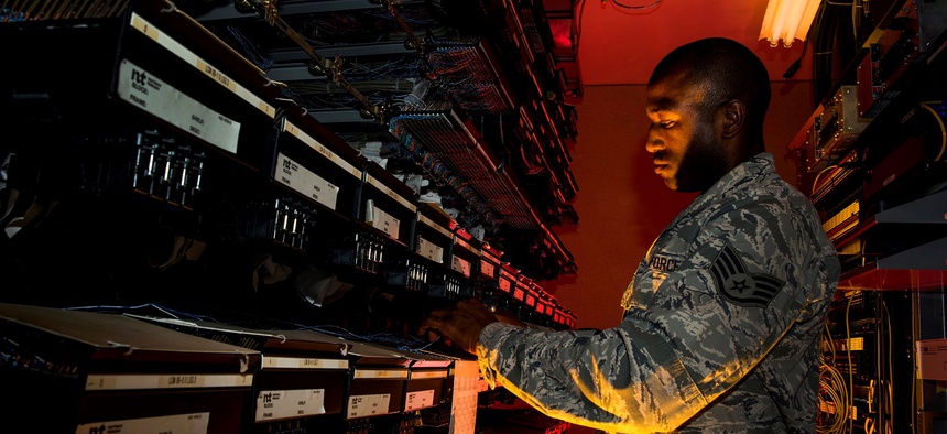 A U.S. Air Force cyber transport systems technician at work Aug. 8, 2013, at Joint Base Charleston, S.C.