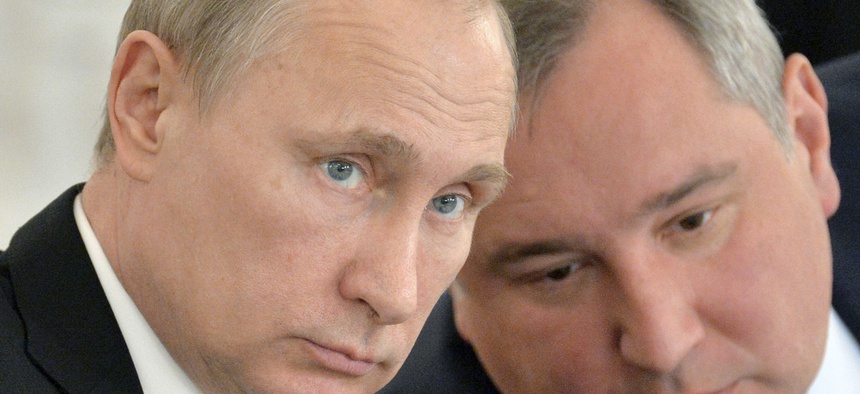 Russian President Vladimir Putin, left, and his defense czar Dmitry Rogozin at the Kremlin last year.