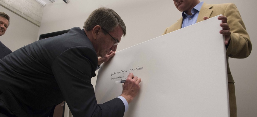 Secretary of Defense Ash Carter signs the guest board at Galvanize San Francisco, March 1, 2016.