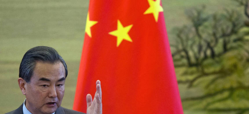 In this April 8, 2016 file photo, Chinese Foreign Minister Wang Yi gestures during a joint press conference with his German counterpart Frank-Walter Steinmeier in Beijing.