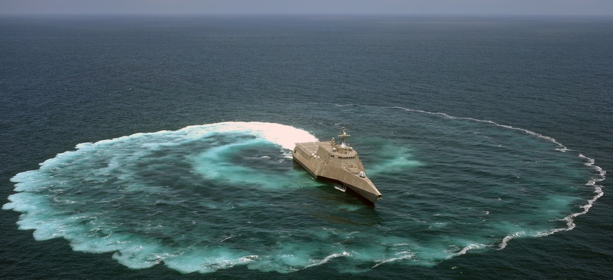 The littoral combat ship USS Independence (LCS 2) demonstrates its maneuvering capabilities in the Pacific Ocean off the coast of San Diego.