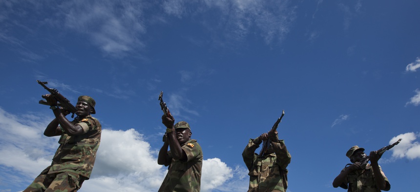 Soldiers from the Uganda People's Defence Force (UPDF) engage in weapons training at the Singo training facility in Kakola, Uganda Monday, April 30, 2012.