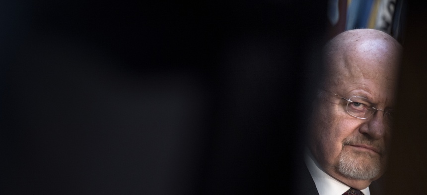 Director of National Intelligence James R. Clapper listens during a retirement ceremony at the National Security Agency Friday March 28, 2014, at Fort Meade, Md.