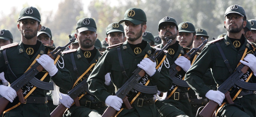 In this picture taken on Sunday, Sept. 21, 2008, Iranian Revolutionary Guards members march during a parade just outside of Tehran.