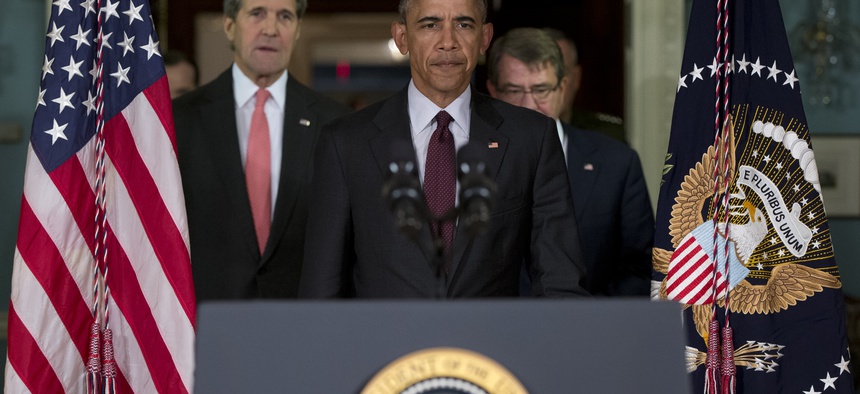 President Barack Obama emerges from a National Security Council meeting at the State Dept., Feb. 2016, with Secretary of State John Kerry, left, Defense Secretary Ash Carter, right, and Joint Chiefs Chairman Gen. Joseph Dunford.