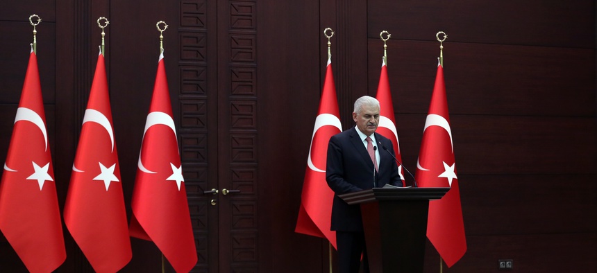 Turkey's Prime Minister Binali Yildirim announces the details of an agreement reached with Israel, in Ankara, Turkey, Monday, June 27, 2016.