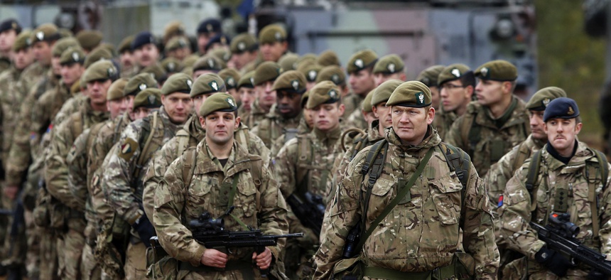 In this Nov. 13, 2014 file photo, British soldiers attend a military exercise 'Iron Sword 2014', at the Gaiziunu Training Range in Pabrade some 60km.(38 miles) north of the capital Vilnius, Lithuania.