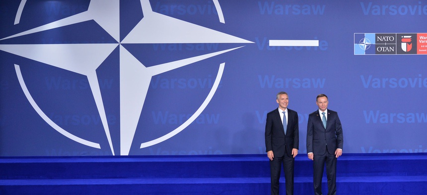NATO Secretary General Jens Stoltenberg and the President of Poland, Andrzej Duda, pose at the July 8 opening of the NATO Summit in Warsaw.