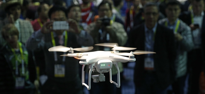 In this Jan. 7, 2016, file photo, a drone hovers at a booth during CES International, Thursday, Jan. 7, 2016, in Las Vegas.