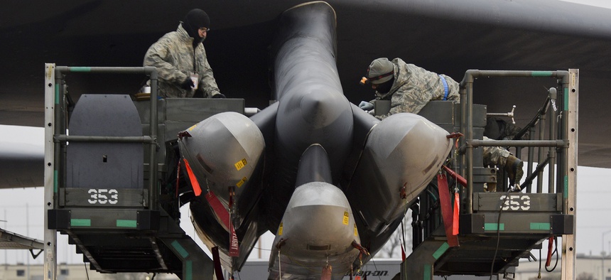 Airmen assigned to the 5th Aircraft Maintenance Squadron load AGM-86/B air-launched cruise missiles onto the wing of a B-52H Stratofortress at Minot Air Force Base, N.D., on Nov. 3, 2015.