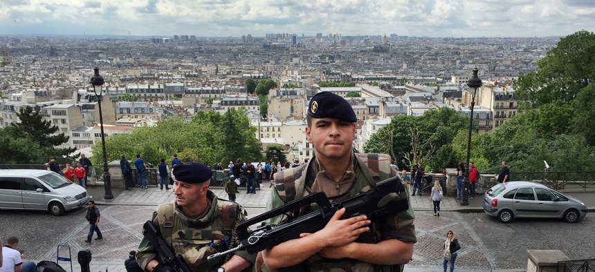 French army soldiers walk up the stairs to Sacre Coeur basilica in Paris, France, Thursday June, 16, 2016.