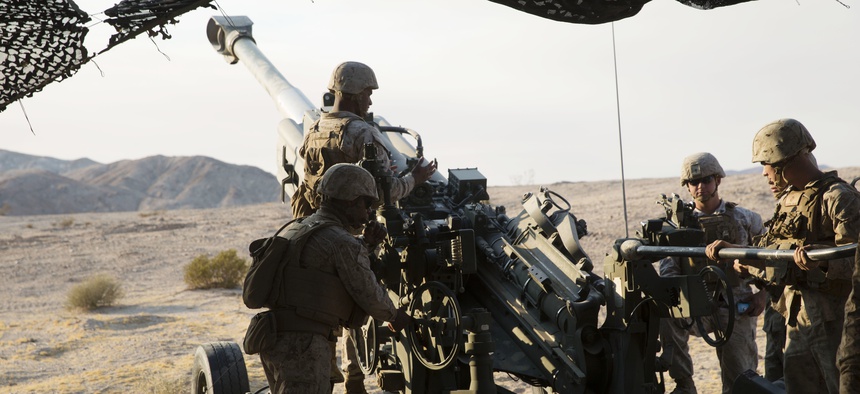 Marines prepare to fire an M777A2 howitzer during an excercise at the at Marine Corps Air-Ground Combat Center Twentynine Palms, Calif., Aug. 16, 2016.