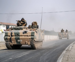 Turkish army tanks and armored personnel carriers move toward the Syrian border, in Karkamis, Turkey, Thursday, Aug. 25, 2016. Turkish army tanks and armored personnel carriers move toward the Syrian border, in Karkamis, Turkey, Thursday, Aug. 25, 2016.
