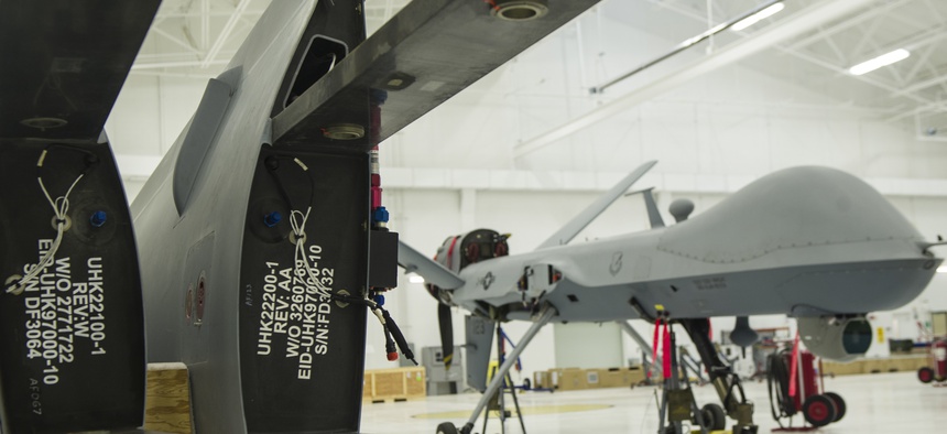 An MQ-9 Reaper sits in a hangar prior to having the wings put on at Holloman Air Force Base, Oct. 13, 2015.