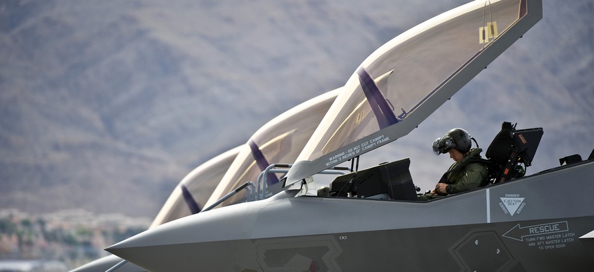 A U.S. Air Force pilot conducts preflight checks inside an F-35A Lightning II before a training mission April 4 at Nellis Air Force Base, Nev., April 4, 2013.