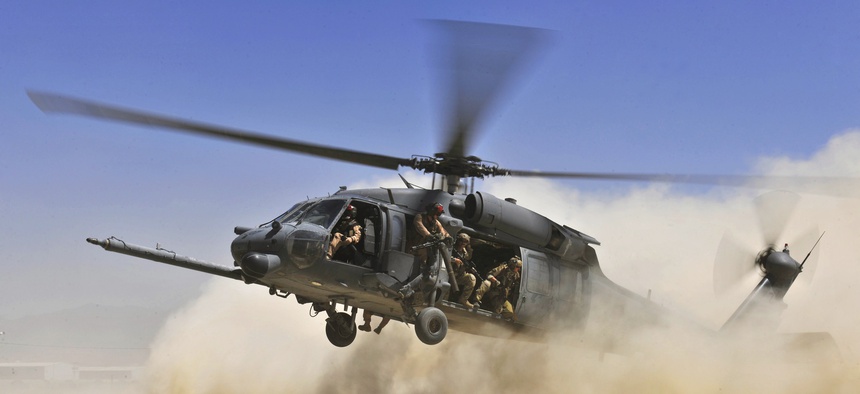 A U.S. Air Force HH-60G Pave Hawk helicopter carrying combat search and rescue Airmen approaches a landing zone during an exercise Aug. 21, 2010, at Bagram Airfield, Afghanistan.