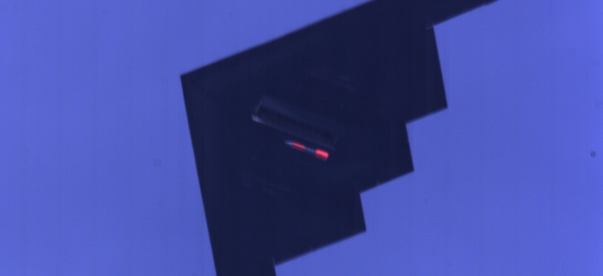 A B-2 stealth bomber drops an inert B61 nuclear bomb.