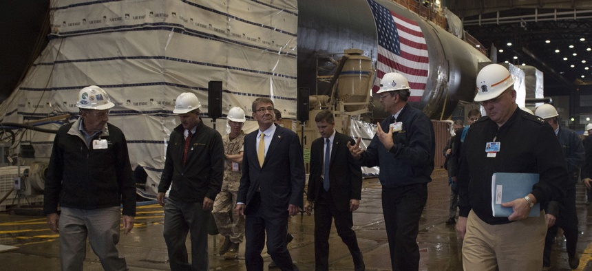 Secretary of Defense Ash Carter walks with General Dynamics Electric Boat Facility leaders as he tours the facility in New London, Conn., during a visit May 24, 2016.