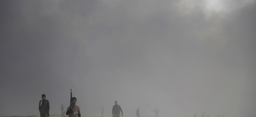 Iraqi soldiers advance towards the city of Mosul, Iraq, Wednesday, Oct. 19, 2016.