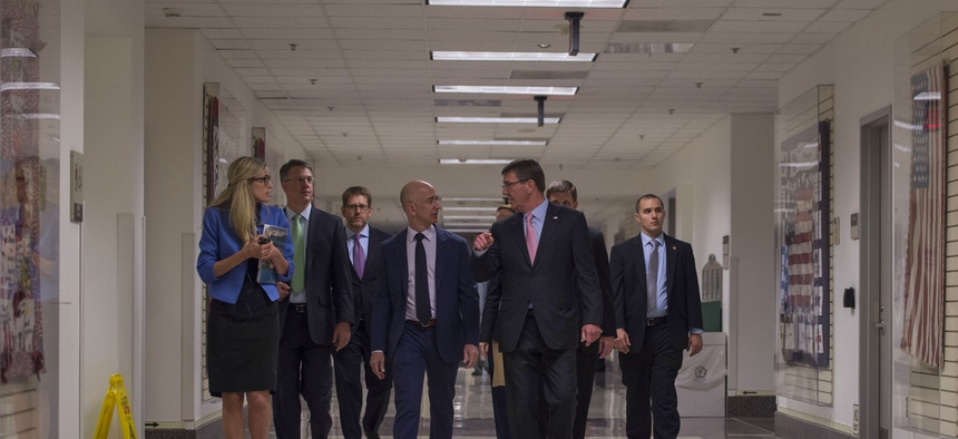Secretary of Defense Ash Carter speaks with Jeff Bezos, Founder, Chairman & CEO of Amazon.com as they tour the Pentagon during a visit May 5 , 2016.