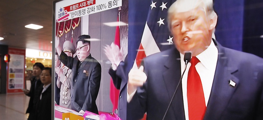 A TV screen shows pictures of U.S. President-elect Donald Trump, right, and North Korean leader Kim Jong Un, at the Seoul Railway Station in Seoul, South Korea, Thursday, Nov. 10, 2016.