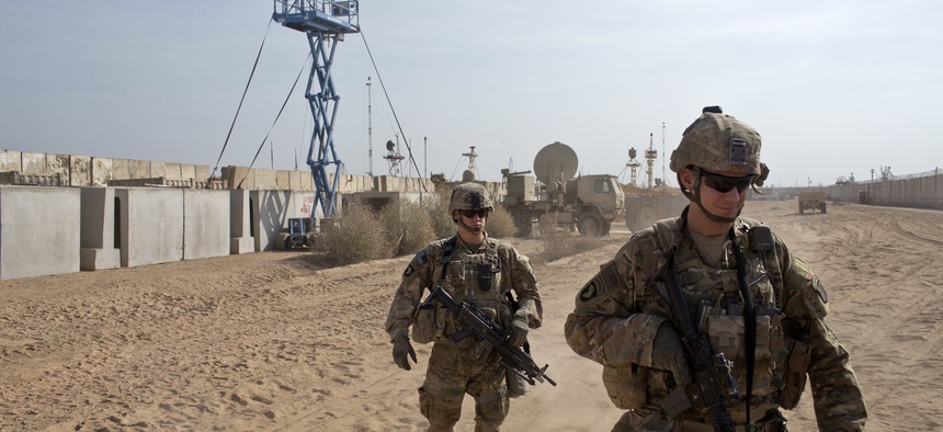 U.S. Army soldiers move through Qayara West Coalition base in Qayara, some 50 kilometers south of Mosul, Iraq, Wednesday, Nov. 9, 2016. Kurdish peshmerga forces continued their push on the town of Bashiqa, some 13 kilometers (8 miles) northeast of Mosul.