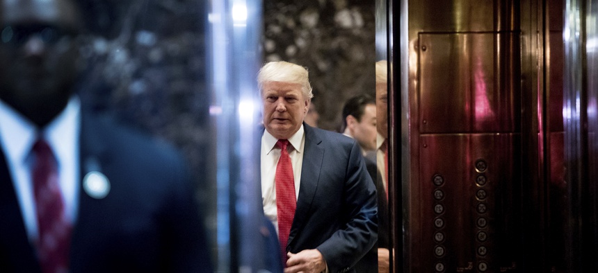 President-elect Donald Trump boards an elevator after speaking with the media at Trump Tower in New York, Tuesday, Dec. 6, 2016.