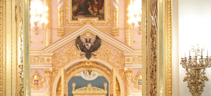 Russian President Vladimir Putin enters a hall to attend a reception marking Heroes of the Fatherland Day in the Kremlin in Moscow, Russia, Friday, Dec. 9, 2016.