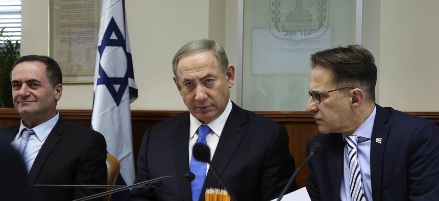 Israeli Prime Minister Benjamin Netanyahu, center, opens the weekly cabinet meeting at his Jerusalem office on Sunday, Dec. 4, 2016.
