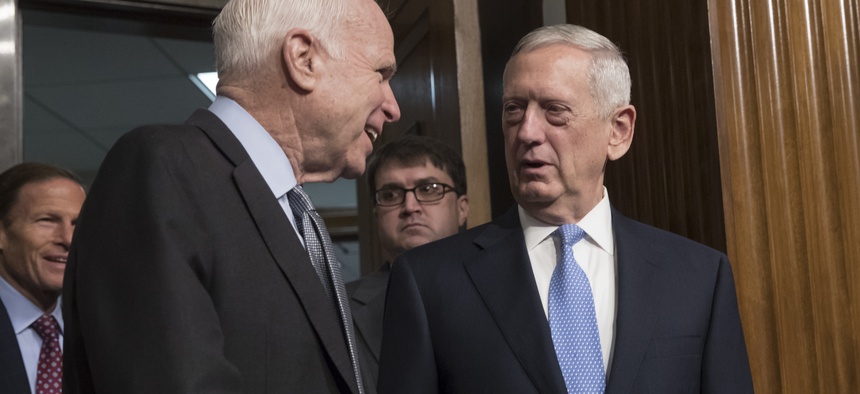 Senate Armed Services Committee Chairman Sen. John McCain, R-Ariz., left, welcomes Defense Secretary-designate James Mattis on Capitol Hill in Washington, Thursday, Jan. 12, 2017.
